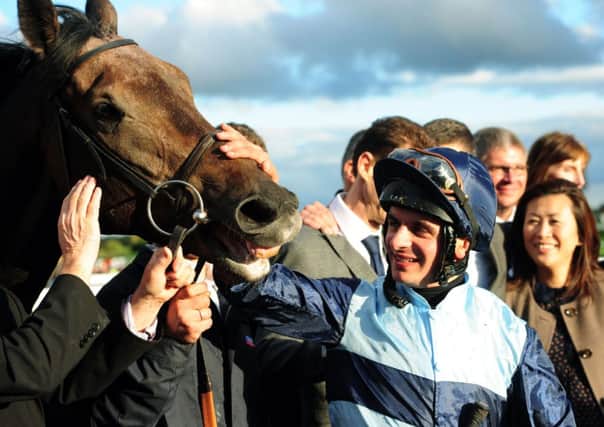 Jockey Andrea Atzeni celebrates with Kingston Hill after winning the Racing Post Trophy during Racing Post Trophy Saturday at Doncaster Racecourse, Doncaster. (Picture: Anna Gowthorpe/PA Wire)