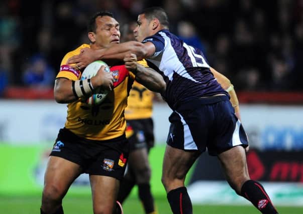 Papa New Guinea's Neville Costigan (left) is tackled by France's Jamal Fakir during the 2013 World Cup match at Craven Park, Hull. (Anna Gowthorpe/PA Wire)