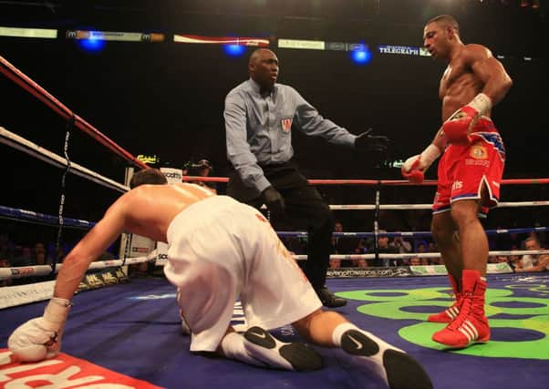 Great Britain's Kell Brook knocks down Ukraine's Vyacheslav Senchenko for the first time in their IBF World Welterweight Eliminator Contest at the Motorpoint Arena, Sheffield. (Nick Potts/PA Wire)