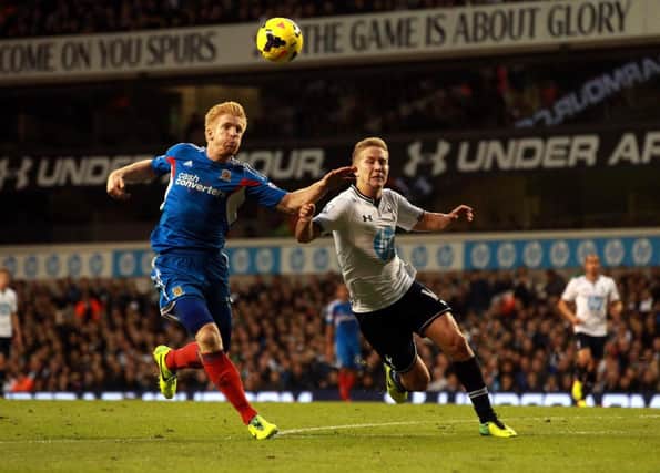 Hull's Paul McShane with Tottenham's Lewis Holtby (right) during the Barclays Premier League match at White Hart Lane, London.