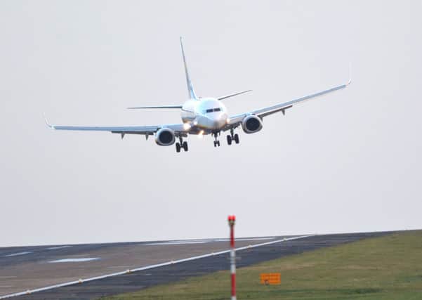 An aircraft battles the wind to land at Leeds Bradford Airport. PIC: Ross Parry
