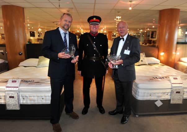 Vice Lord Lieutenant Tim Hare with Simon Spinks, left, and Peter Spinks at the presentation of a Queens Award for Business to Harrison Spinks bed makers, Beeston