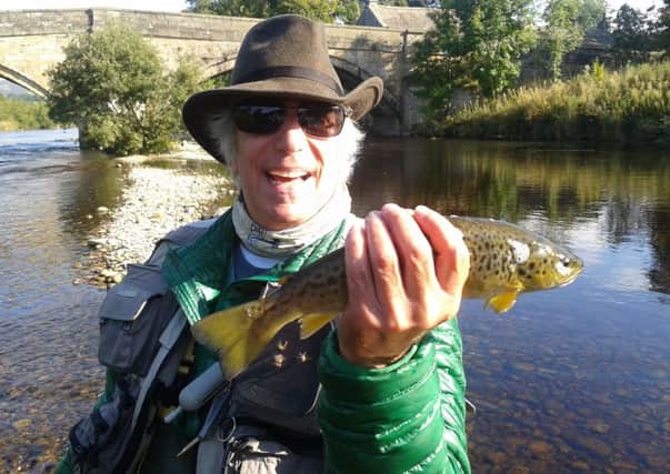 Henry Winkler with his first wild brown trout.