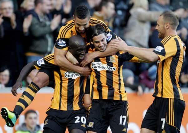 Hull City's Yannick Sagbo (bottom left) celebrates his goal with Jake Livermore (top) George Boyd (bottom right) and David Meyler.