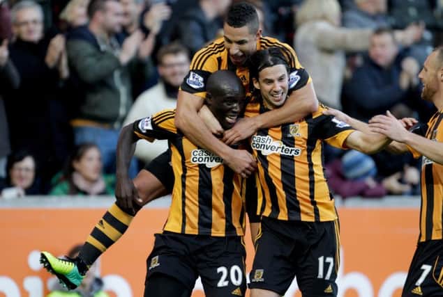 Hull City's Yannick Sagbo (bottom left) celebrates his goal with Jake Livermore (top) and George Boyd
