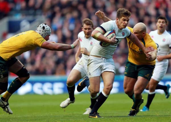 England's Owen Farrell breaks through to score their second try