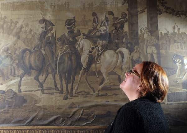 Curator of History Alison Bodley looks at one of the scenes