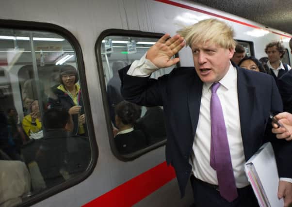 Mayor of London Boris Johnson travels from Xidan to Gongzhufenin on Line 1 of the Beijing Metro