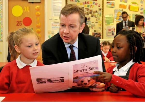 Education Secretary Michael Gove with children at the Cuckoo Hall Primary School in Edmonton, London