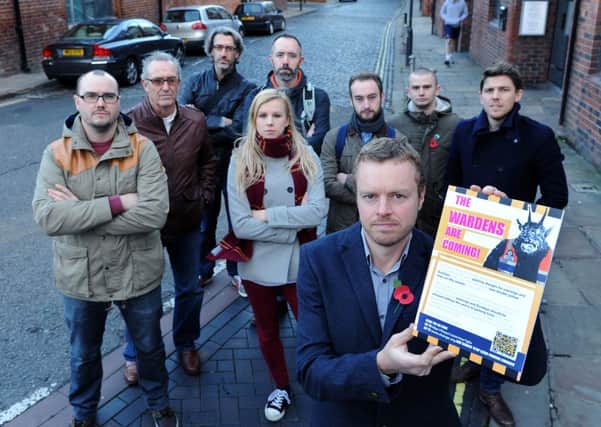 Paul Ellison and The Calls traders promote the petition against evening and weekend parking charges in Leeds.