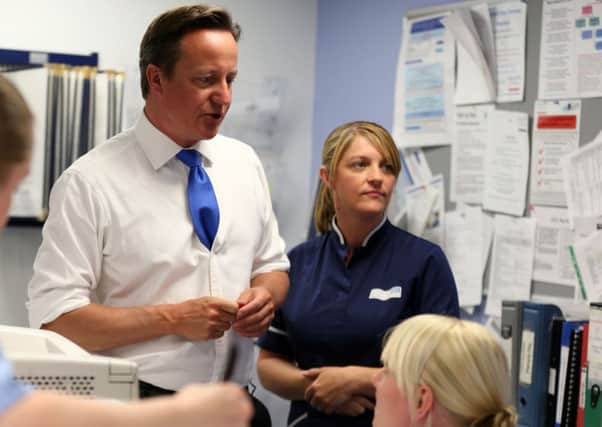 Prime Minister David Cameron talks to NHS staff