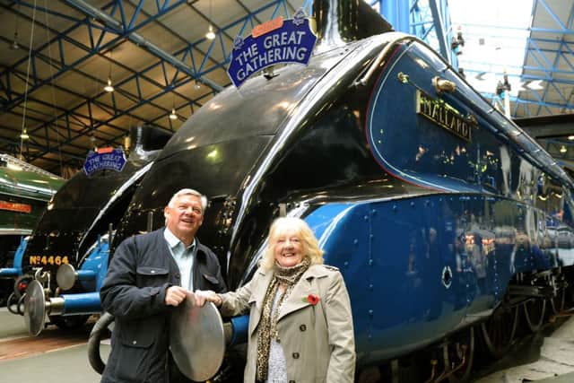 Julie Slater with her son Richard in front of Mallard at the National Railway Museum in York.