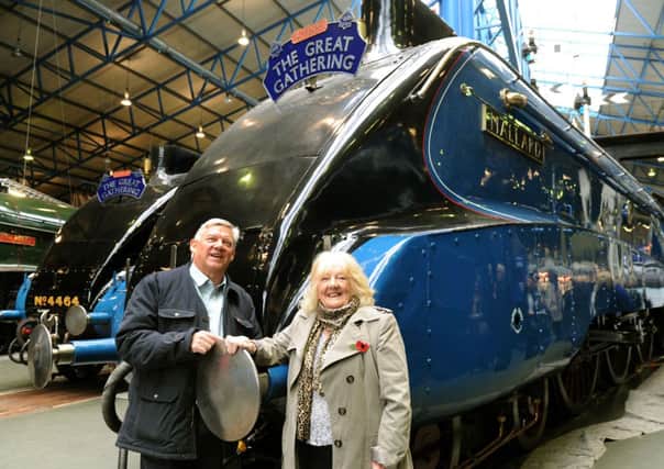Julie Slater with her son Richard in front of Mallard at the National Railway Museum in York.