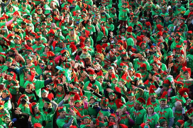 People dressed as Elves take part in the Guinness World Record for the largest gathering of Santa's Elves, at Stockeld Park, Wetherby.