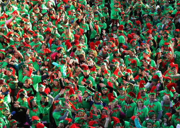 People dressed as Elves take part in the Guinness World Record for the largest gathering of Santa's Elves, at Stockeld Park, Wetherby.