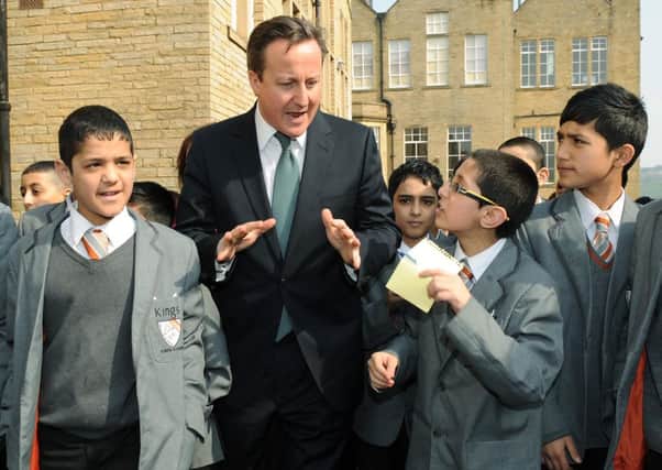 David Cameron meets children from Kings Science Academy, Bradford, during a visit last year