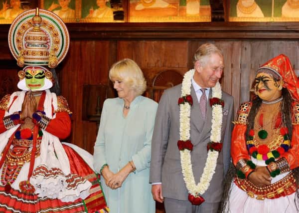 The Prince of Wales and the Duchess of Cornwall meet a dancers from the Kerala Folklore Theatre and Museum after a performance for the Royal couple in Kochi, south west India
