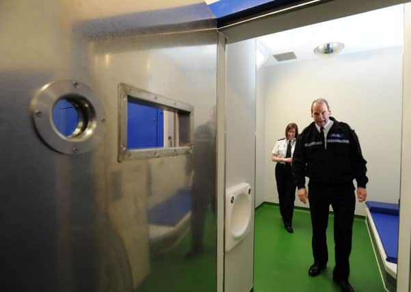 Then Chief Constable Sir Norman Bettison visits the custody suite at Pudsey Police Station two years ago.