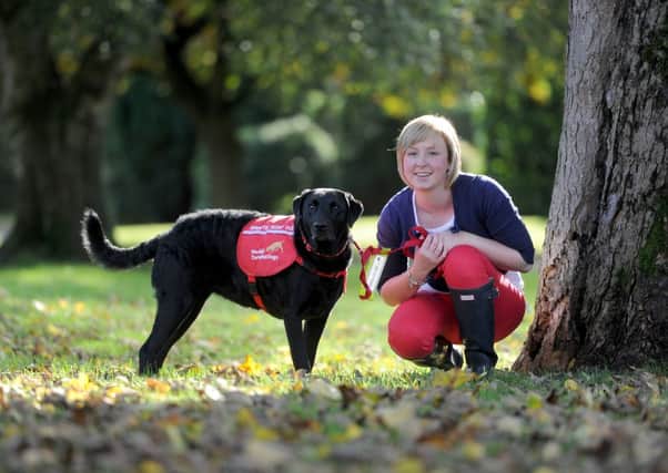 Alice Halstead with her diabetic alert dog Holly, and below with her mum