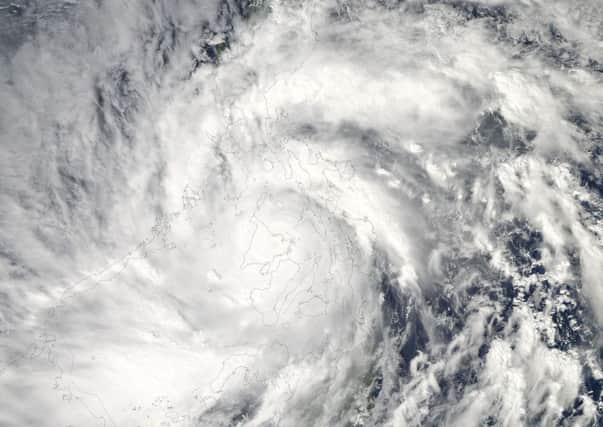 This image provided by NASA shows Typhoon Haiyan taken by the Aqua satellite