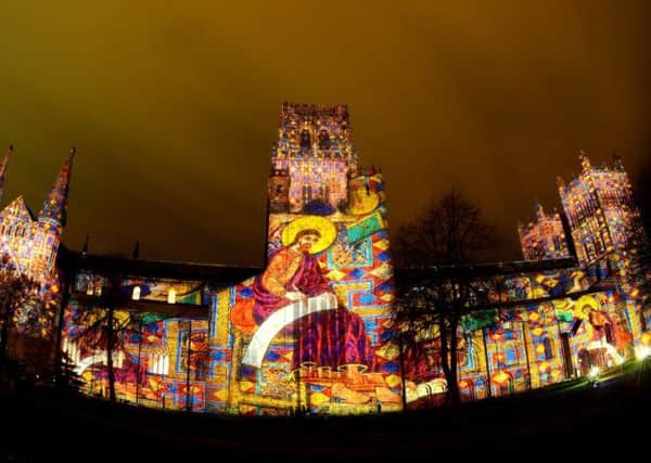Manuscripts from the Lindisfarne Gospels projected on Durham Cathedral during the Lumiere celebrations in the town