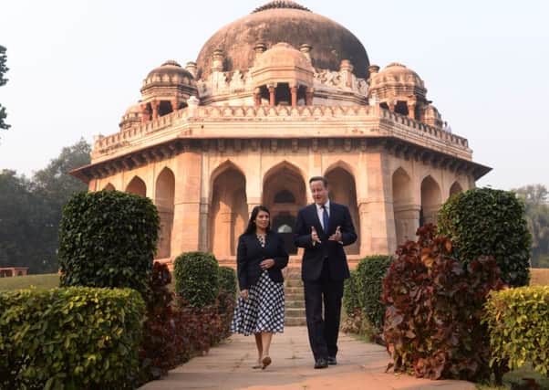 David Cameron with Witham MP Priti Patel in front of the Shah Sayyid Tomb in the Lodi Gardens in Delhi