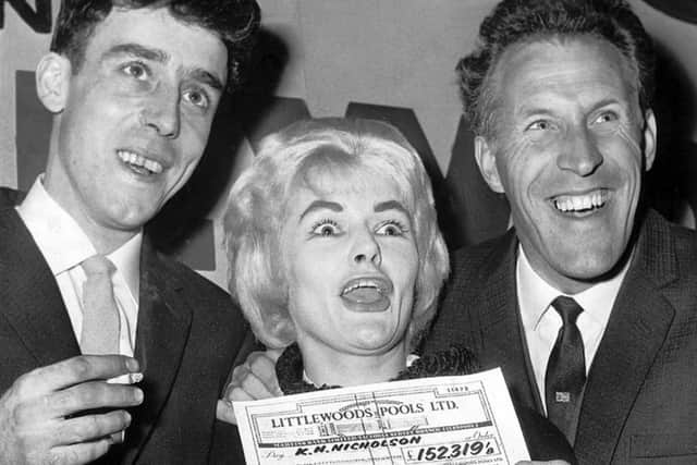 Viv Nicholson and husband Keith collect their Littlewoods pools cheque from Bruce Forsyth in 1961