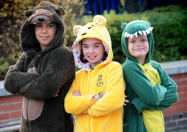 Mia Sharp with fellow pupils Muhammad Benomran and Alexander Clough at Kirkstall Valley Primary school, wearing their pyjamas to support Children in Need.