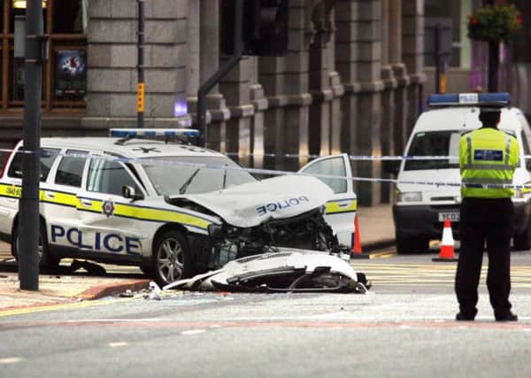 The wreckage of a police traffic car in Leeds city centre