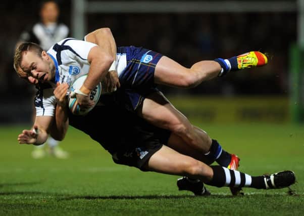 NO WAY THROUGH: Scotland's Ian Henderson is stopped by the Kiwis' Simon Mannering. Picture: Bruce Rollinson.