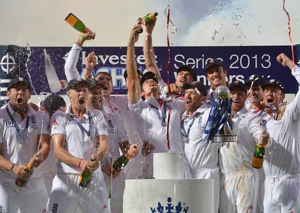England celebrate as Alastair Cook lifts the Ashes Urn in August.