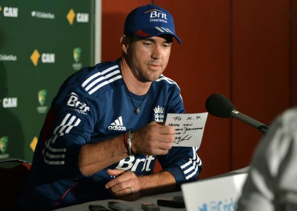 England's Kevin Pietersen receives a message from Wally Lewis as he speaks during a press conference at The Gabba, Brisbane, Australia. Picture: Anthony Devlin/PA Wire.