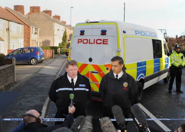 Chief Inspector Rick Gooch from Derbyshire Police (left) and area manager for Derbyshire Fire and Rescue Kam Basi (right) give a statement at the scene of a house fire on Williamthorpe Road in North Wingfield, Chesterfield, where four people, including two children, have been killed. PIC: PA