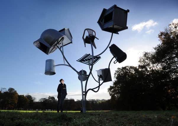 Kerry Chase pictured with one of the Trees from Alternative Landscape Components by Dennis Oppenheim, at the Yorkshire Sculpture Park