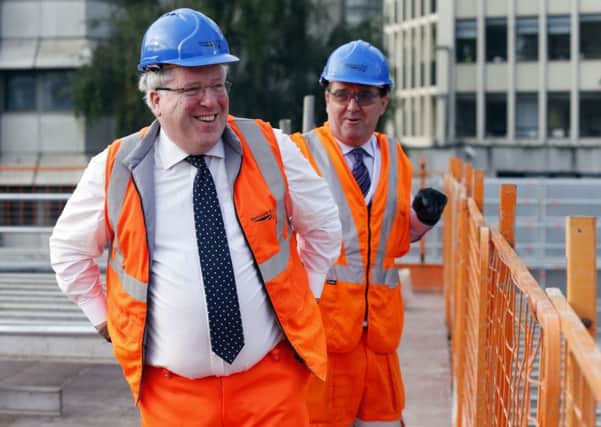 Transport Secretary Patrick McLoughlin (left) at the London Bridge railway construction site in London.