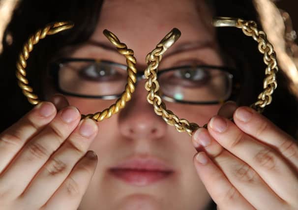 Assistant curator of Archeaology at the Yorkshire Museum, Natalie McCaul, with the 2,000 year old torcs