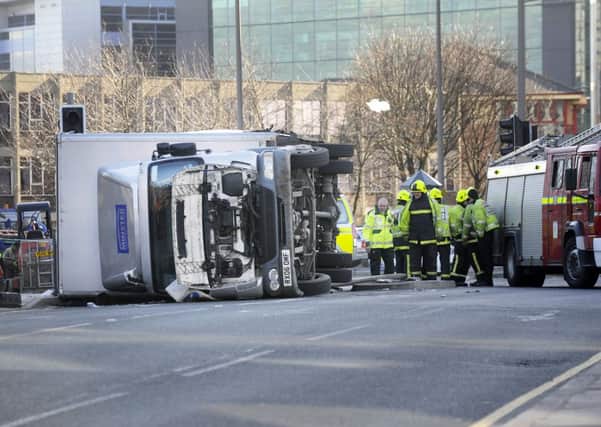The scene after the lorry was blown over  at the foot of Bridgewater Place in Leeds