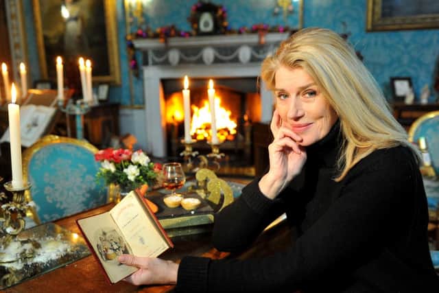 Selina Scott with the Dickens novel that proves Malton was the inspiration for A Christmas Carol. Pictures: Ross Parry Agency