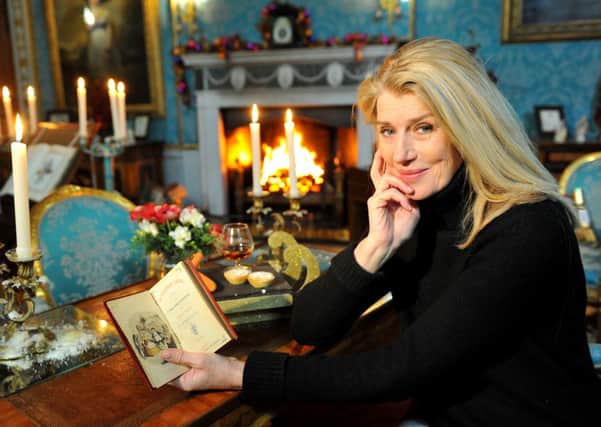 Selina Scott with the Dickens novel that proves Malton was the inspiration for A Christmas Carol. Pictures: Ross Parry Agency