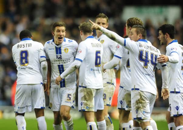 ON THE UP: Ross McCormack, far right, signals his delight after scoring his first goal against Wigan at Elland Road in a 2-0 win on Wednesday night. Picture Tony Johnson.