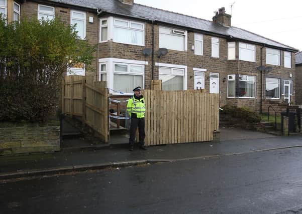 Police outside the house in Spring Hall Gardens, Halifax