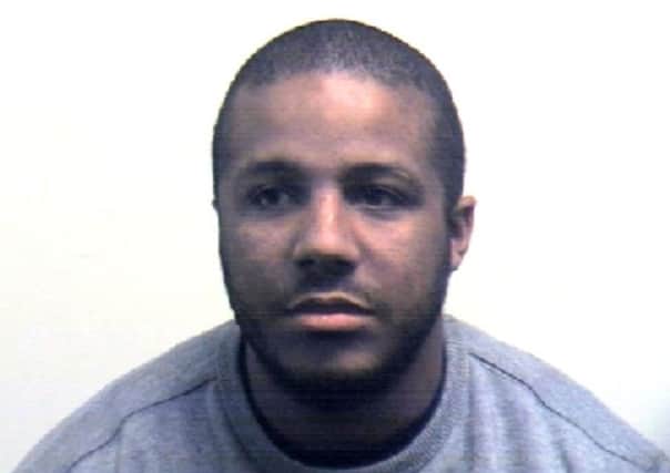 Police picture of Marcus Gad Binghi Thompson