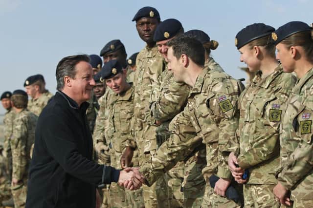 David Cameron talks with British soldiers at Camp Bastion