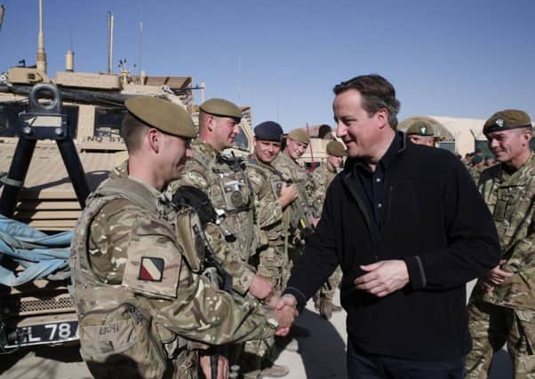 David Cameron talks with British soldiers at Camp Bastion