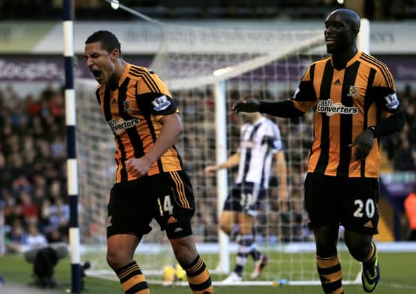 Hull City's Jake Livermore celebrates scoring the opening goal with Yannick Sagbo.