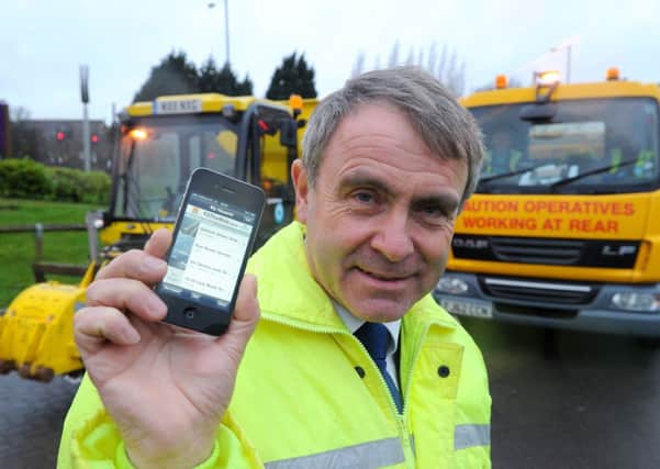 Roads minister Robert Goodwill tries the new 'Fill That Hole' smartphone app