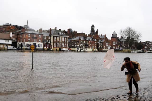 Rising water levels from the River Ouse bring floodwater into riverside roads in York City centre
