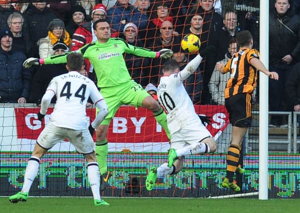 Own goal: James Chester diverts the ball past Hull goalkeeper Steve Harper.