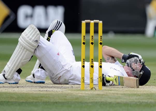 England's Kevin Pietersen lies on the ground after surviving a run out attempt from Australia's Ryan Harris. (AP Photo/Andy Brownbill)