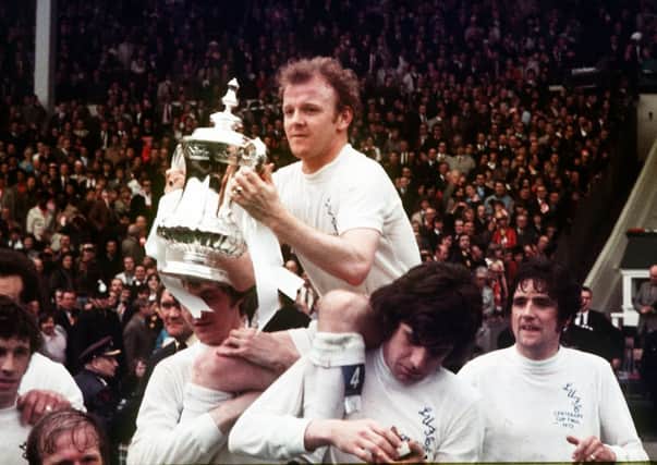 Billy Bremner head and shoulders above his team mates with the F.A. Cup in 1972